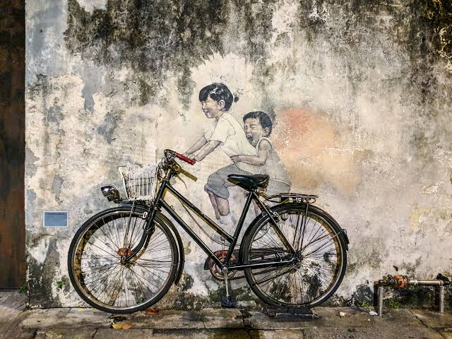 Children on a Bicycle mural by Ernest Zacharevic on Armenian Street, George Town