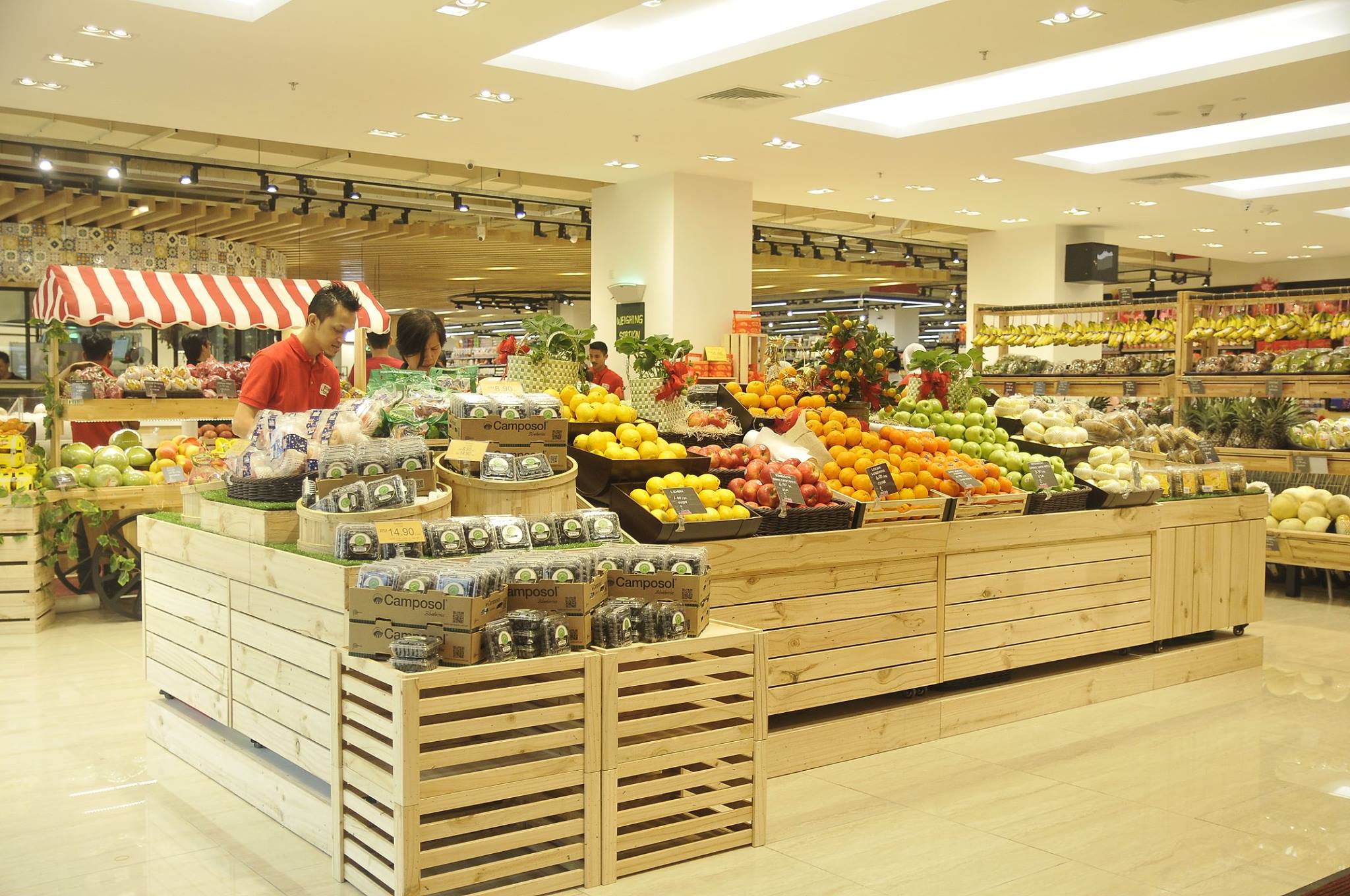 Malaysian food souvenir products on a supermarket shelf including tea, coffee and chocolate