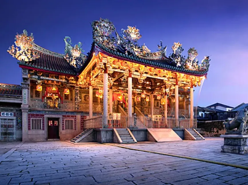 Ornate roof carvings and courtyard of Khoo Kongsi clan temple in George Town