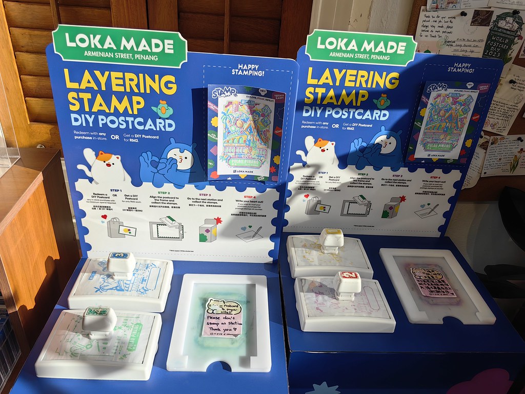 Illustrated postcards and stamping station at Loka Made on Armenian Street, Penang