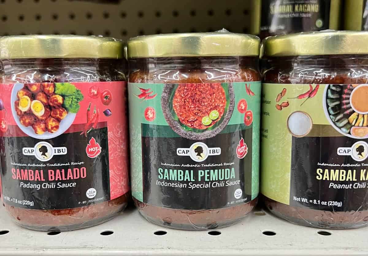 Jars of Malaysian sambal and curry paste on a supermarket shelf