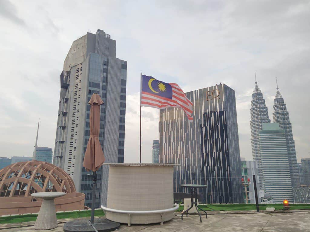 SkyBar at Traders Hotel with the infinity pool and Petronas Twin Towers illuminated in the background