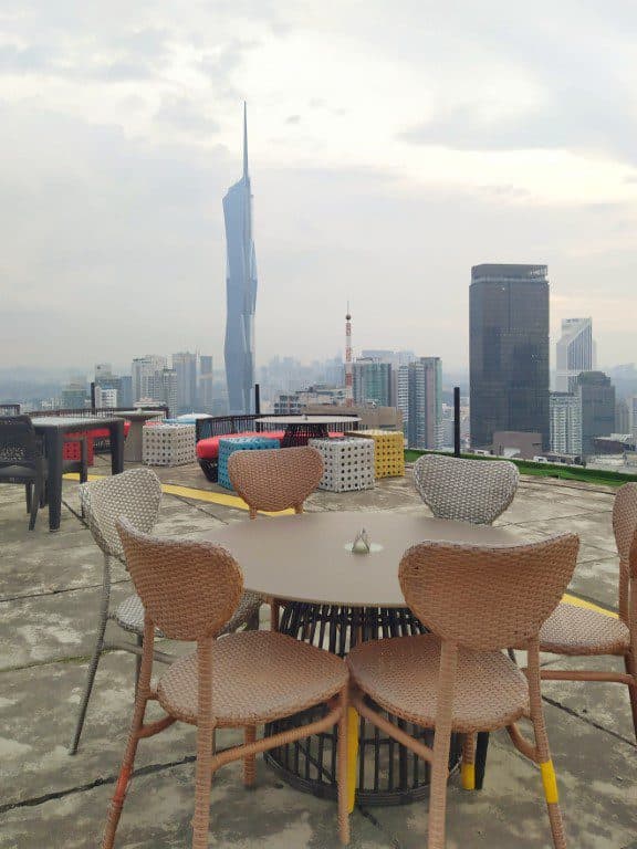 Marini's on 57 interior with the Petronas Towers visible through floor-to-ceiling windows at night