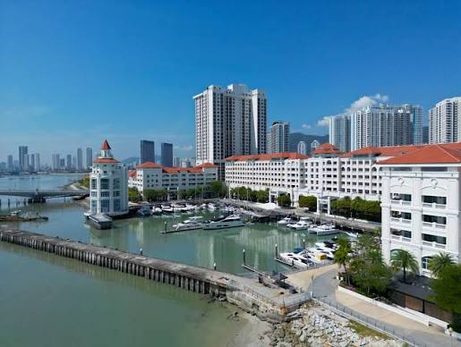 Straits Quay Marina at night with yachts and waterfront restaurants