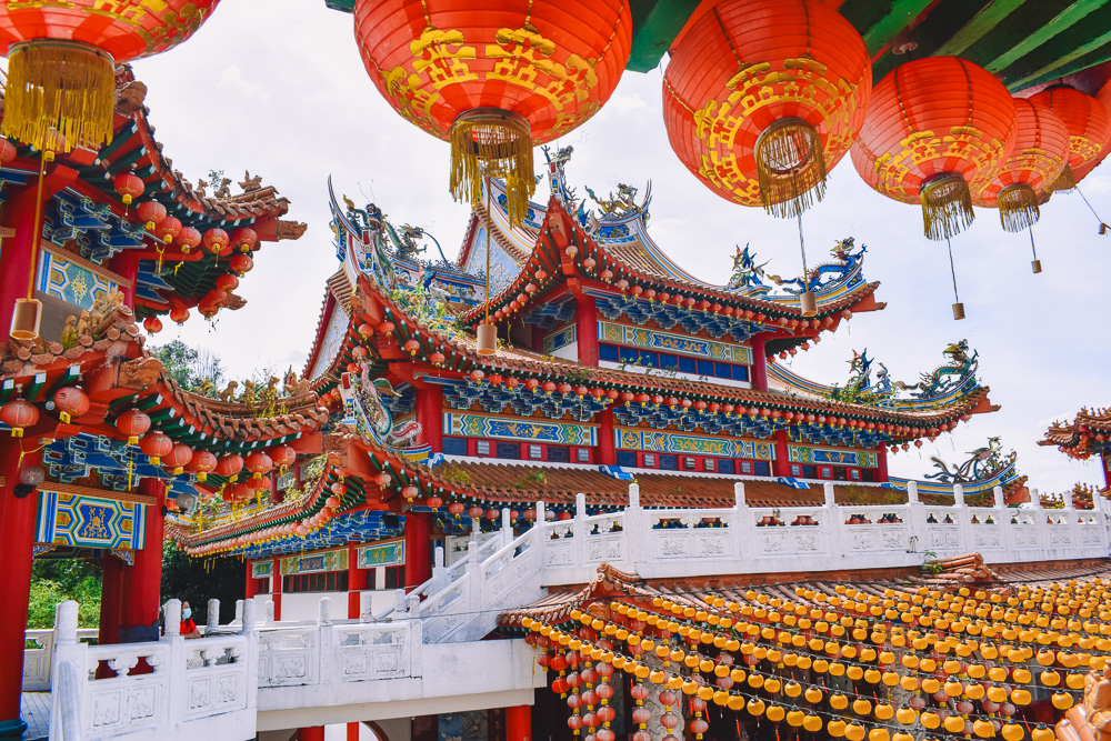 Multi-tiered Thean Hou Temple with red lanterns and ornate roof carvings on Robson Heights